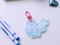 Load and play video in Gallery viewer, Video of Protective charm of Ōkami and the whimsy of a delightful kitty keychain