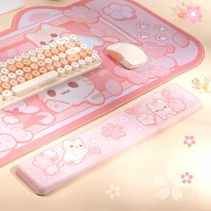 BelugaDesign pink sakura desk mat featured in a cozy kawaii gaming and streaming setup